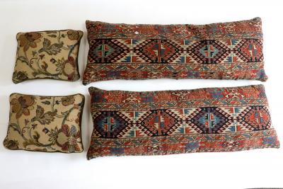 Two carpet covered cushions and