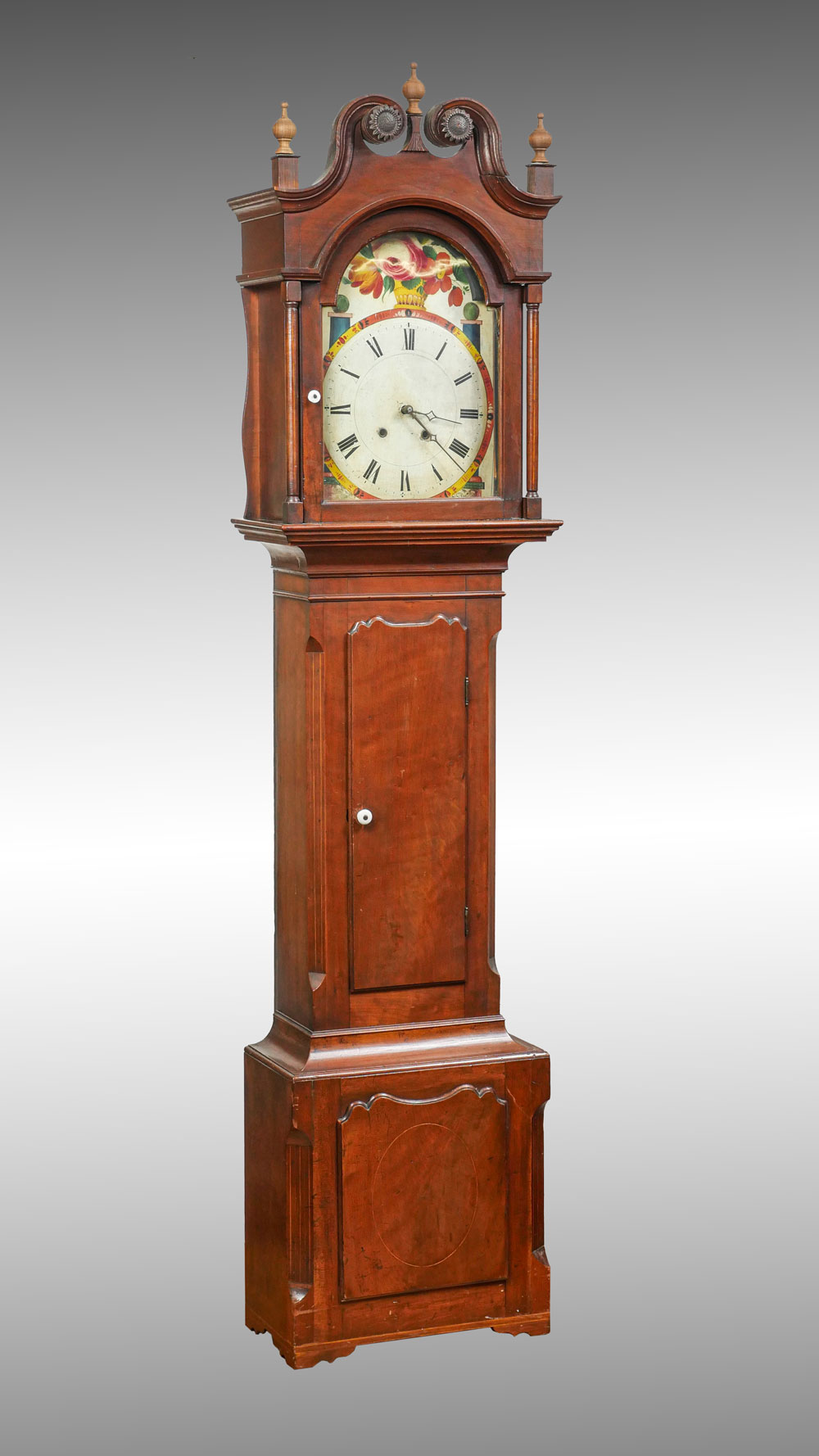 GRANDFATHER CLOCK: Surmounted by a scrolling