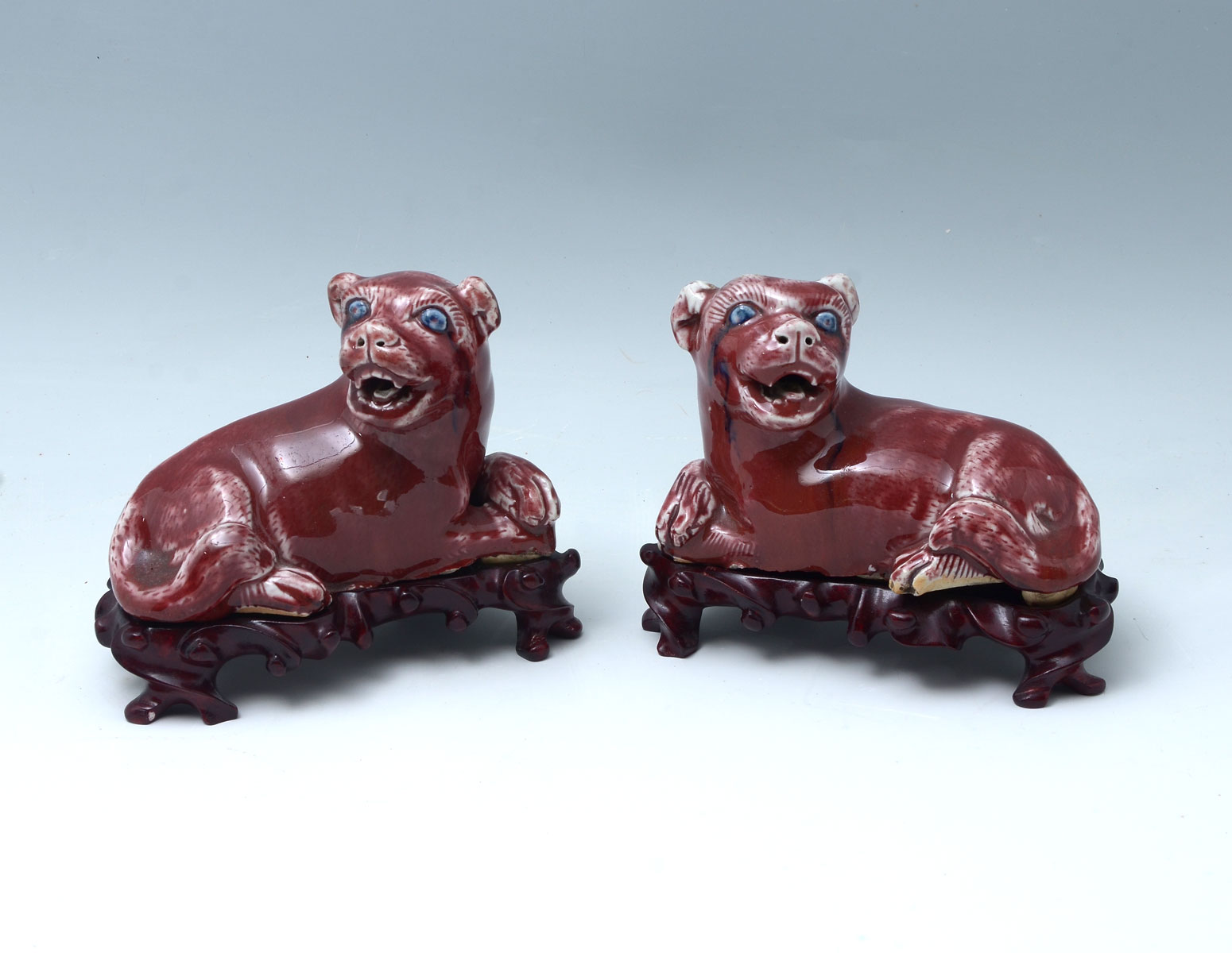 PAIR CHINESE OX BLOOD GLAZED RESTING
