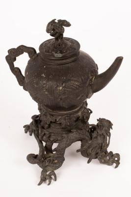 A Japanese bronze teapot on stand,