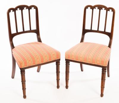 A pair of single chairs with Gothic