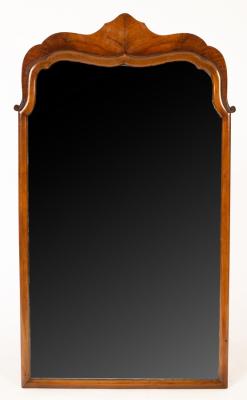 A mahogany arch-top mirror, the glass