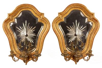A pair of gilt framed girandoles
