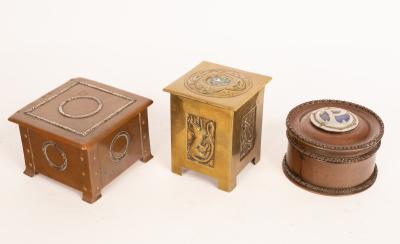 A circular copper money box, initialled