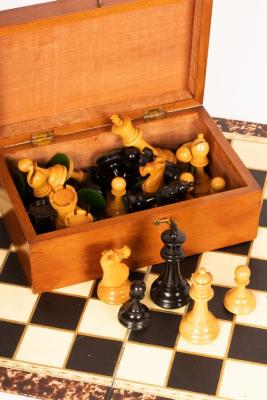 A boxwood and ebonised chess set in
