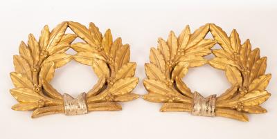 A pair of carved and gilded wall appliques