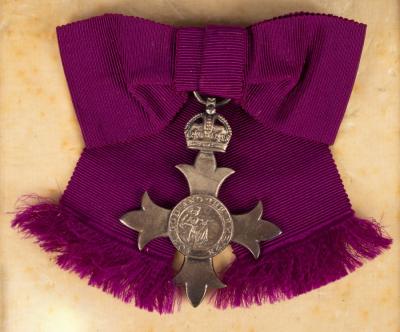 A George V MBE, 1929, boxed by Garrard