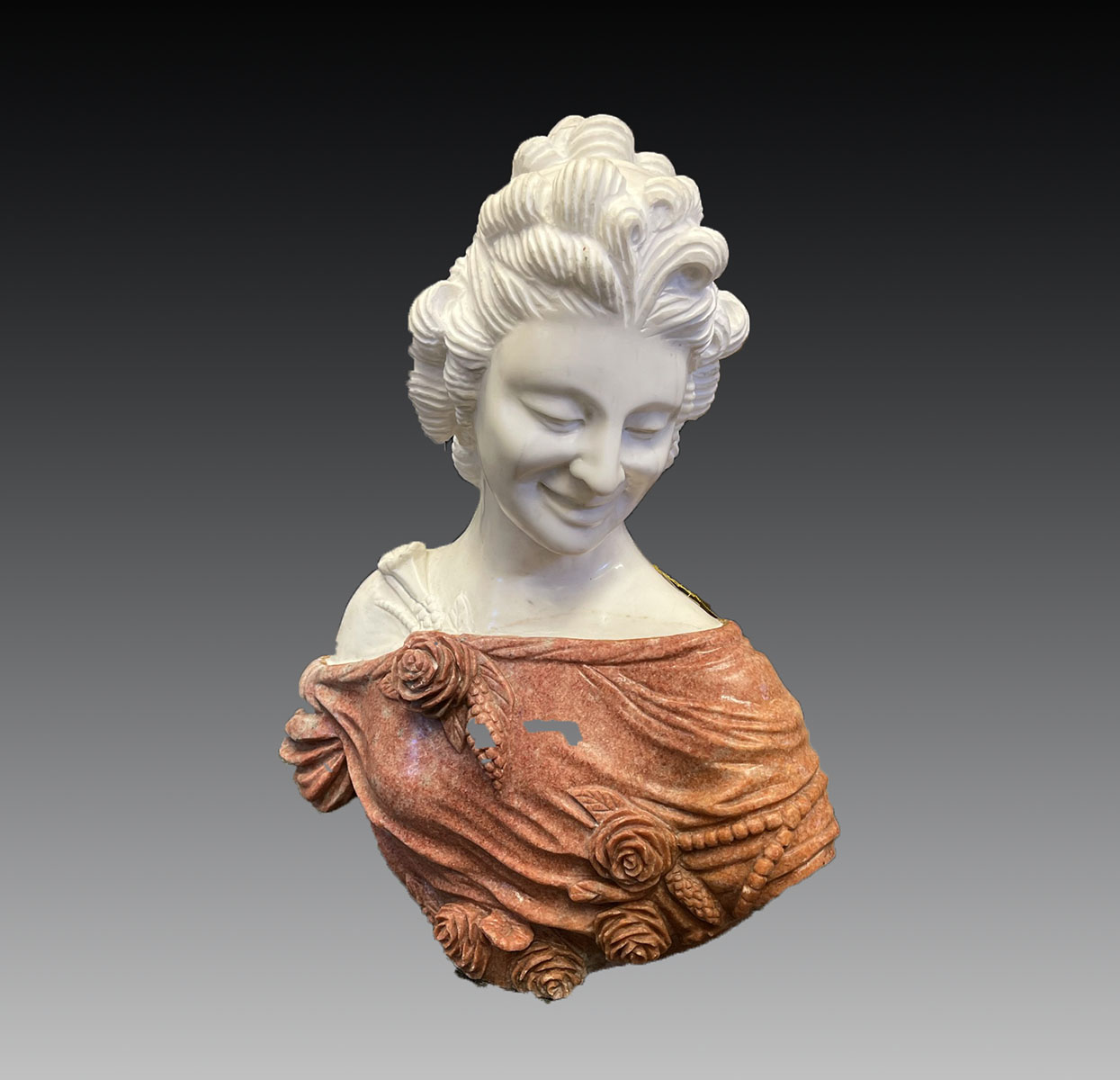 CARVED MARBLE BUST OF A FEMALE: