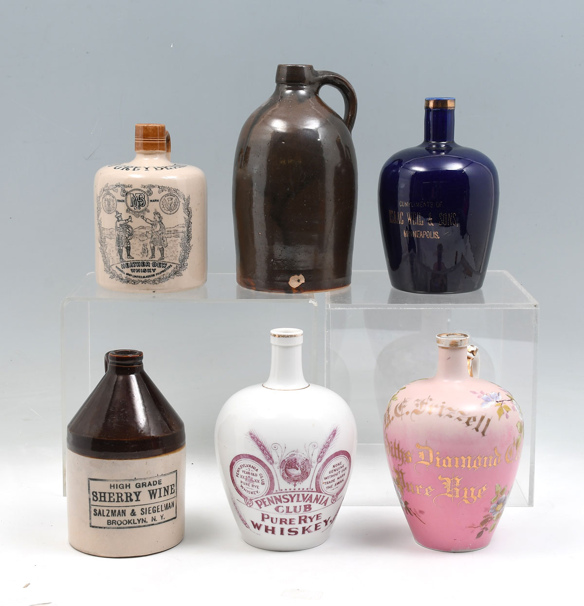 6 PC. EARLY 20TH C. WHISKEY JUGS: Comprising;