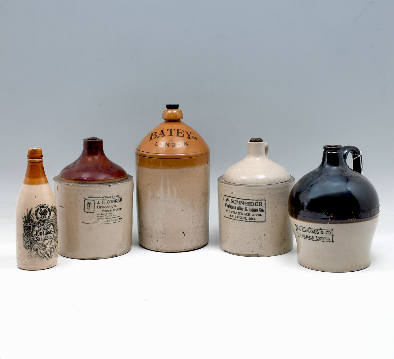 5 PC. ADVERTISING STONEWARE JUGS: