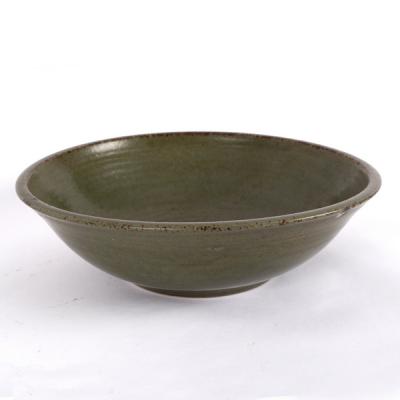 A Studio Pottery bowl with dark green