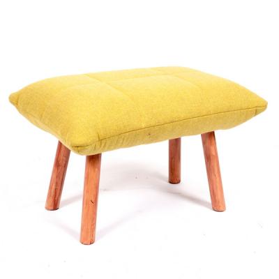 An upholstered stool by Habitat