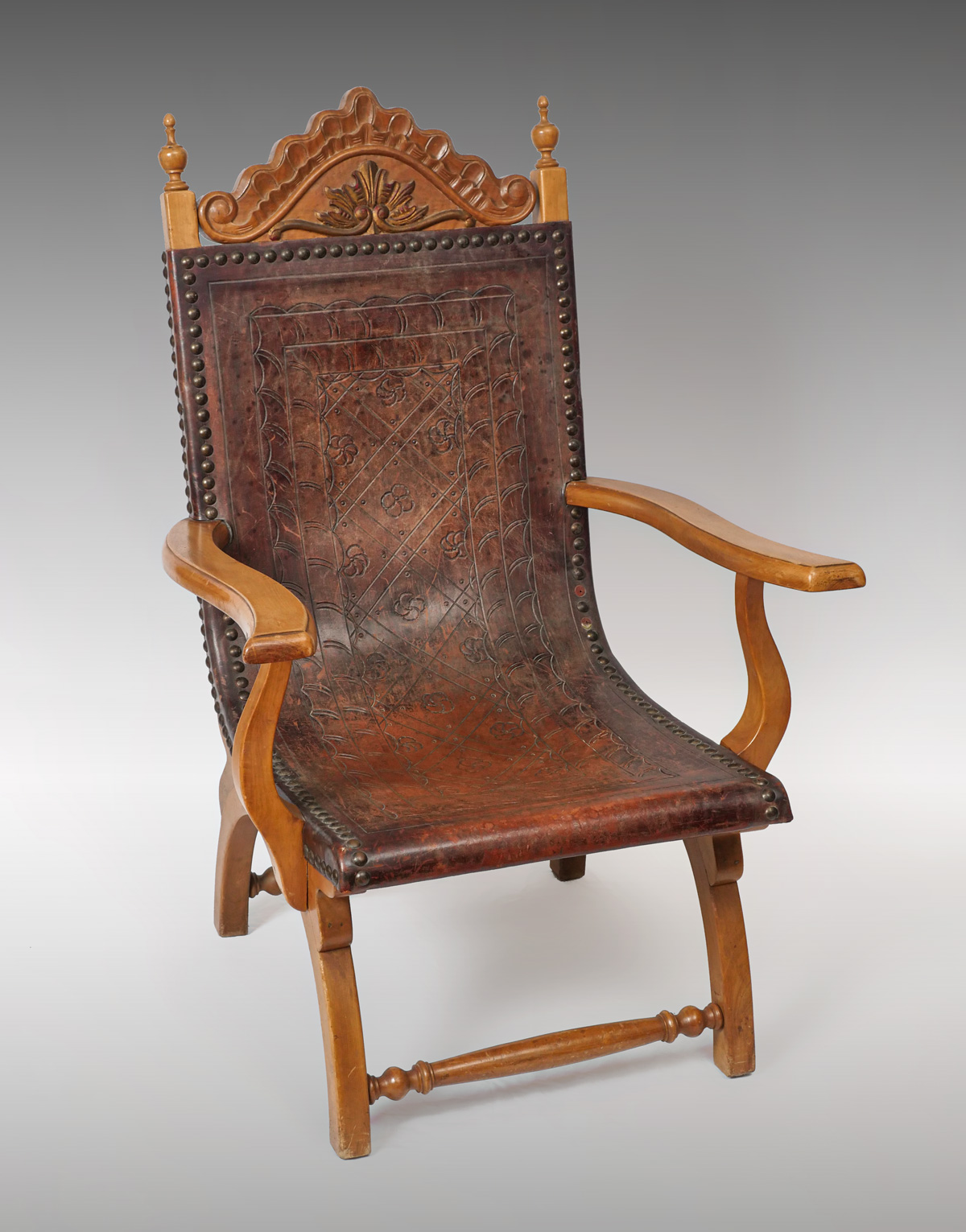 SPANISH EMBOSSED LEATHER CHAIR: