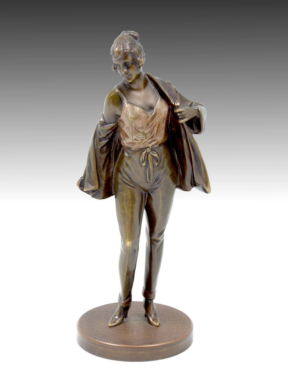PATINATED BRONZE SCULPTURE OF A