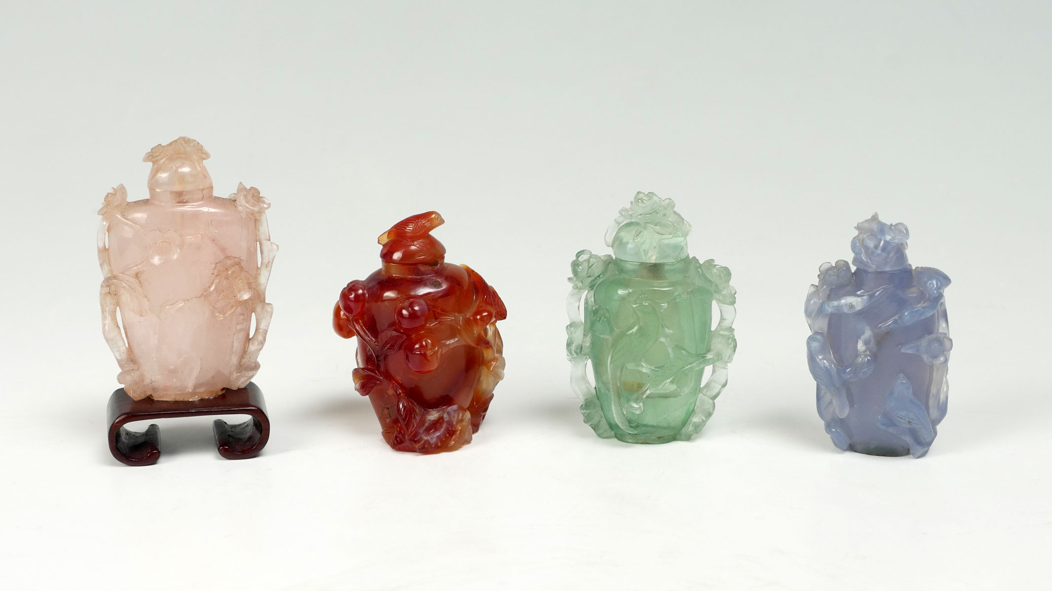 4 CARVED CHINESE SNUFF BOTTLES: