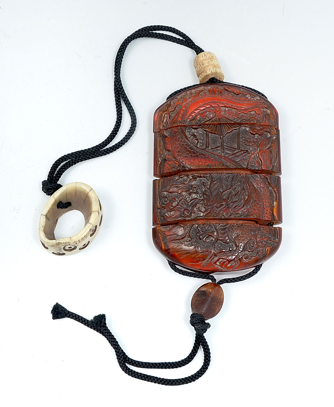 CHINESE CARVED AMBER COLORED INRO: