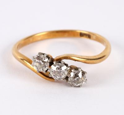 A three-stone diamond ring, of