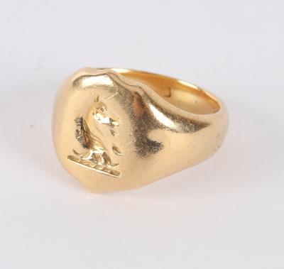 An 18ct gold signet ring worn  36d434