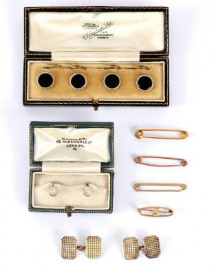 A set of four onyx dress buttons,
