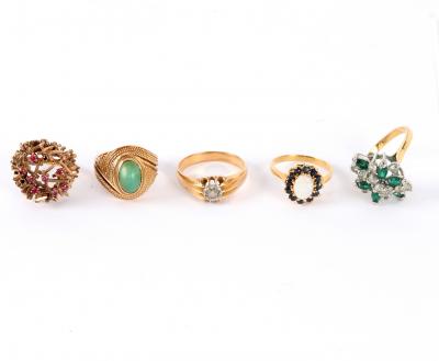 Five dress rings including a ruby