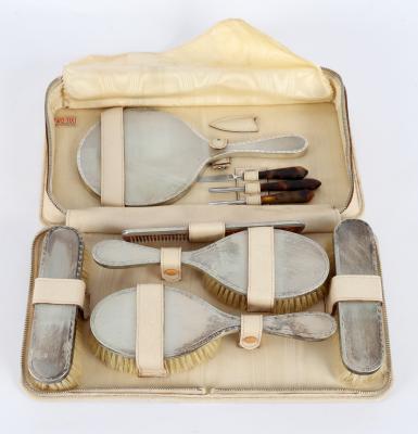 A silver backed travel dressing set,