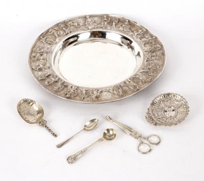 An Eastern white metal dish with 36d4ff