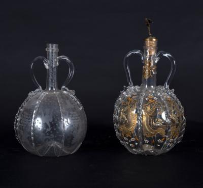 Two Dutch engraved glass decanters,