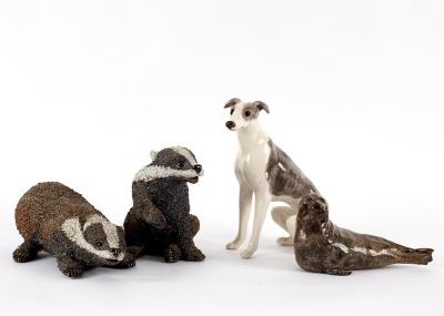 Four pottery models of animals,