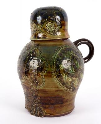 A pottery slipware cider jug and