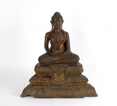 A Thai metal Buddha seated cross-legged