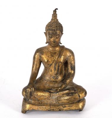 A small gilded figure of a Buddha seated