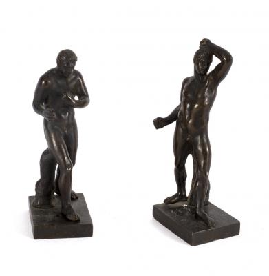 A pair of bronze figures of wrestlers,