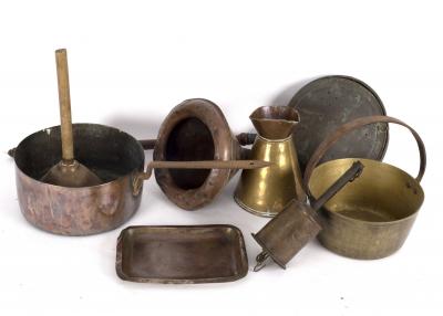 A copper funnel, various copper saucepans