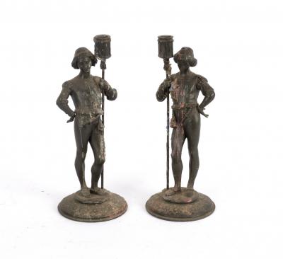 A pair of spelter figural candlesticks