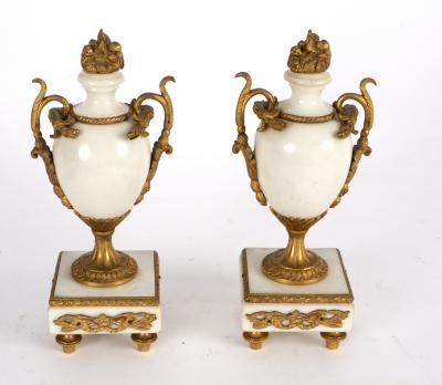 A pair of white marble garniture