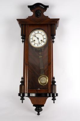 A Vienna type wall clock in a three-glass