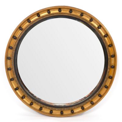 A Regency circular mirror, the