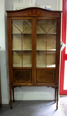 An Edwardian inlaid cabinet, on