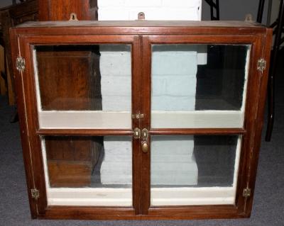 A small double sided display case enclosed