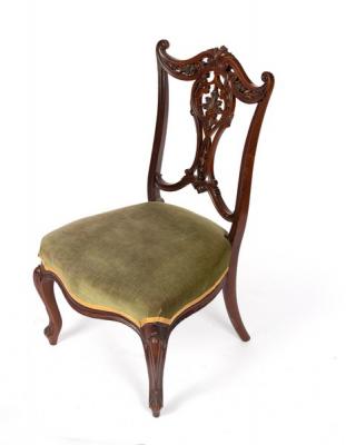 An Edwardian salon chair with upholstered