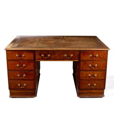 A partners' burr walnut desk, fitted