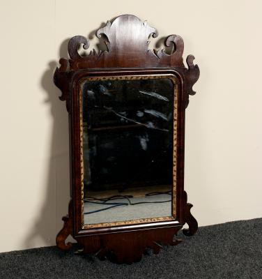 A small mahogany wall mirror with 36d691