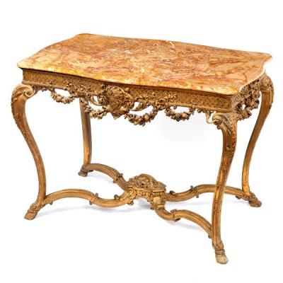 A gilded marble topped table of