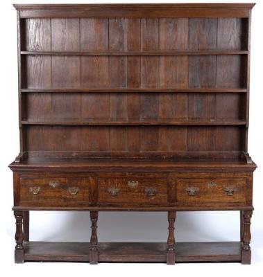 An oak dresser with shelves over,