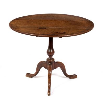An oak table on turned column and