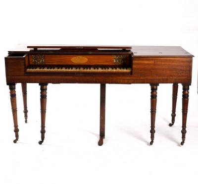A mahogany square piano on turned legs