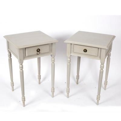 A pair of painted bedside tables,