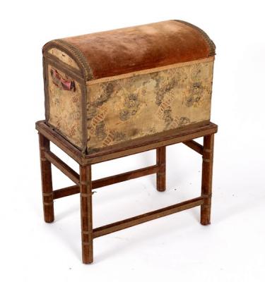 A velvet covered chest with domed