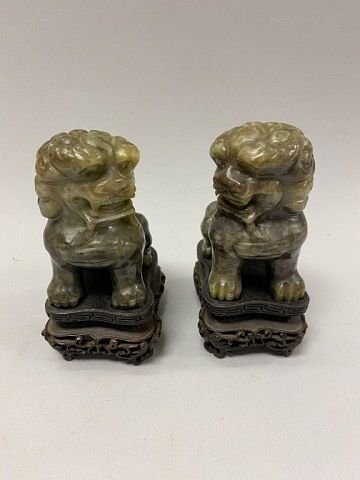 PAIR OF CARVED JADE FOO LIONSOn 36fef1