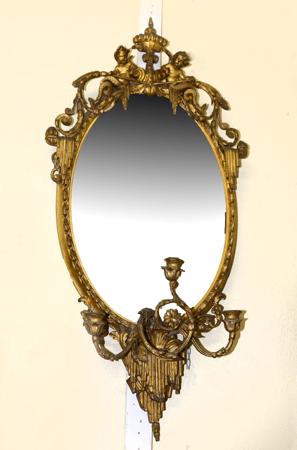 CARVED WALL MIRROR WITH CHERUBIC CREST: